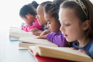  children reading in a classroom